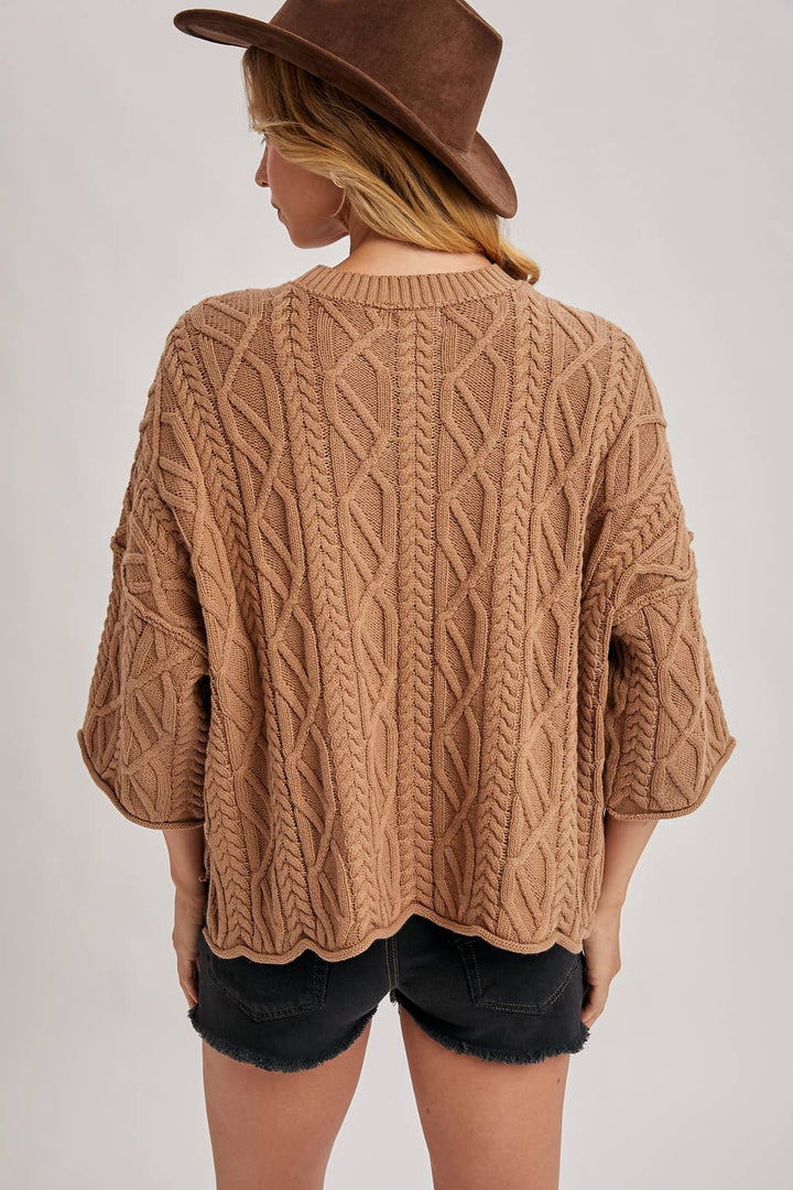 OVERSIZED BELL SLEEVE CABLE KNIT SWEATER
