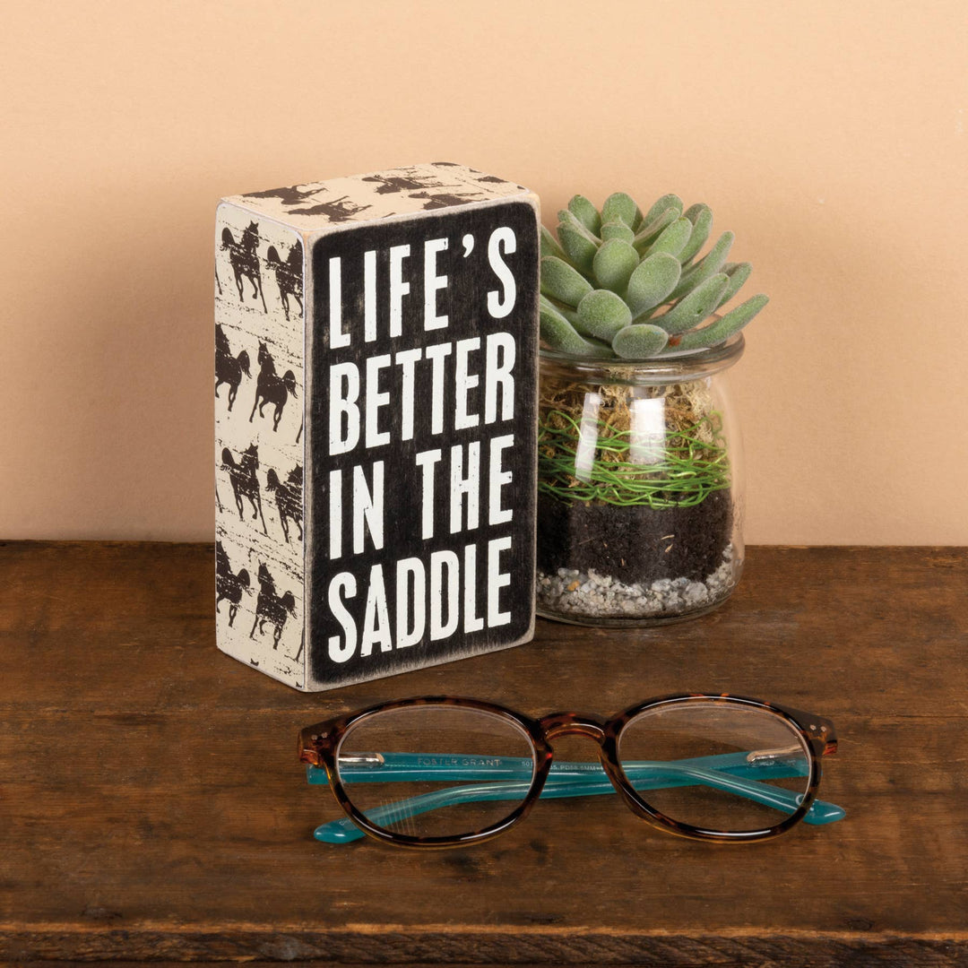 In The Saddle Box Sign
